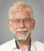 A man wearing glasses and a white shirt. Description generated by AI