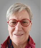 A woman wearing glasses and a red shirt. Description generated by AI