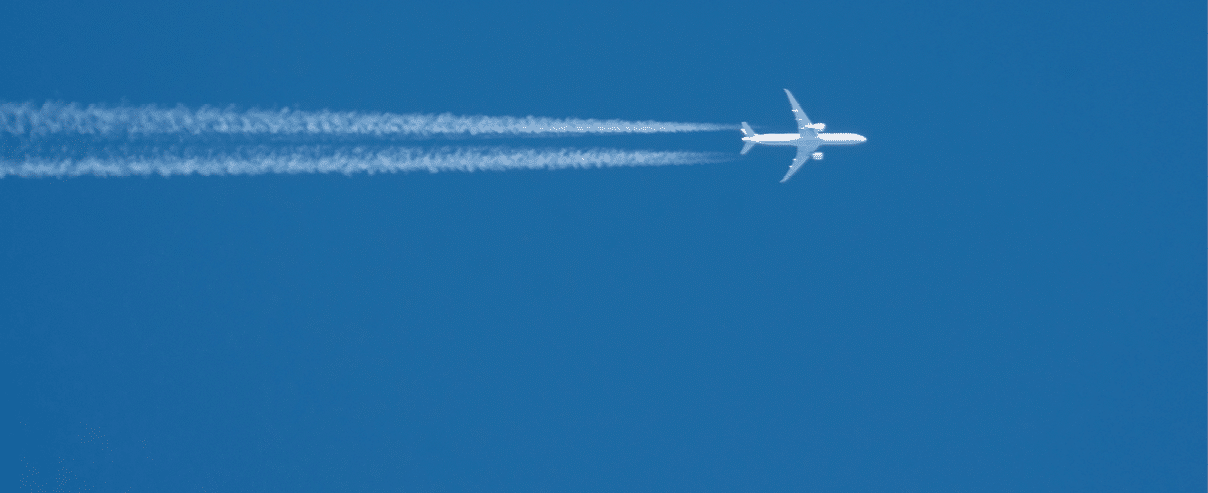 Trail from the plane with two enigine the blue sky