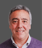 A man wearing a purple sweater. Description generated by AI