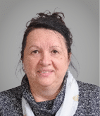 A woman wearing a white scarf. Description generated by AI