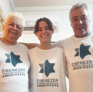 Three people wearing white shirts with a blue star on them. Description generated by AI
