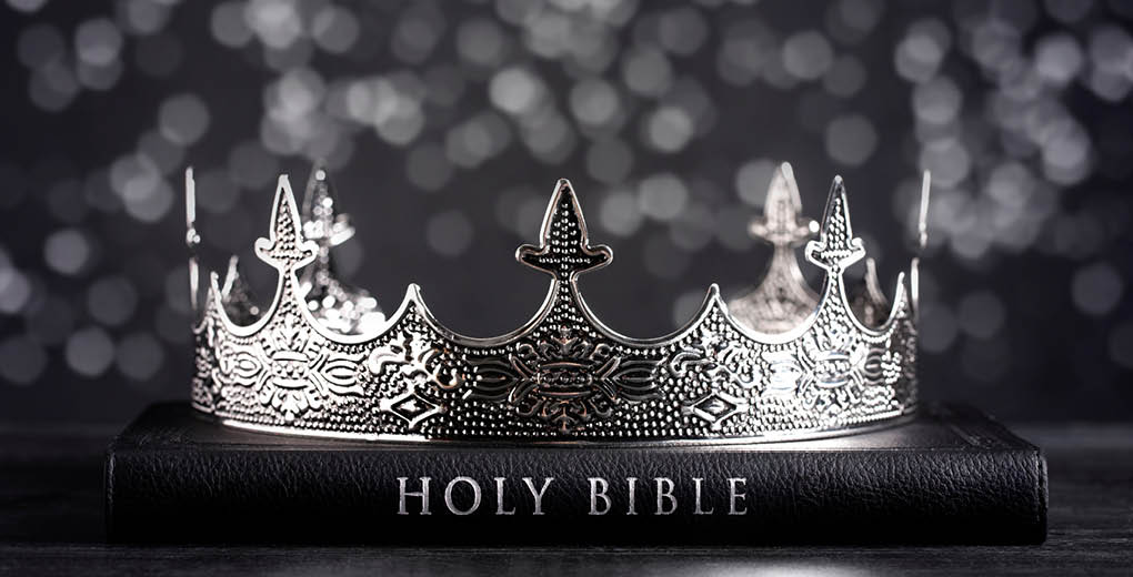 The Holy Bible and a Kings Crown on a Dark Moody Background