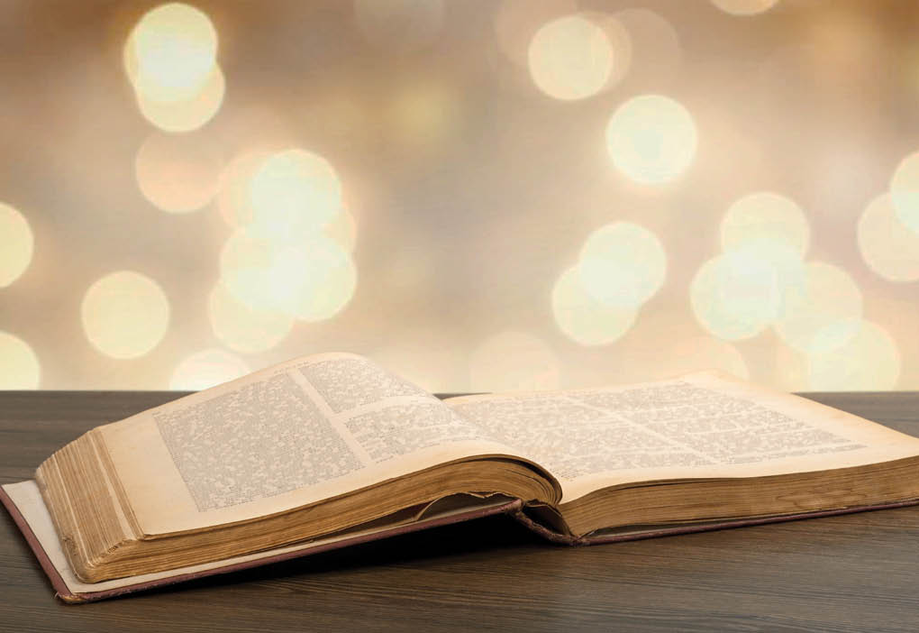 Grunge age book on the wooden desk table space  Retro still life concept