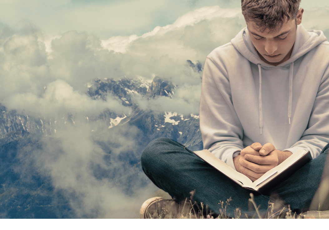 Christian worship and praise  A young man is praying and worshiping in the evening 