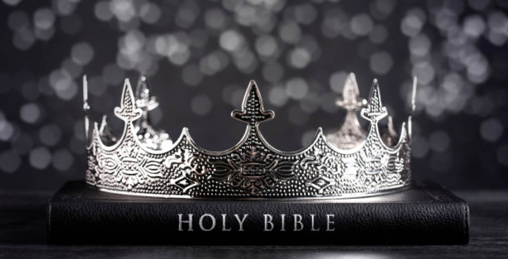The Holy Bible and a Kings Crown on a Dark Moody Background