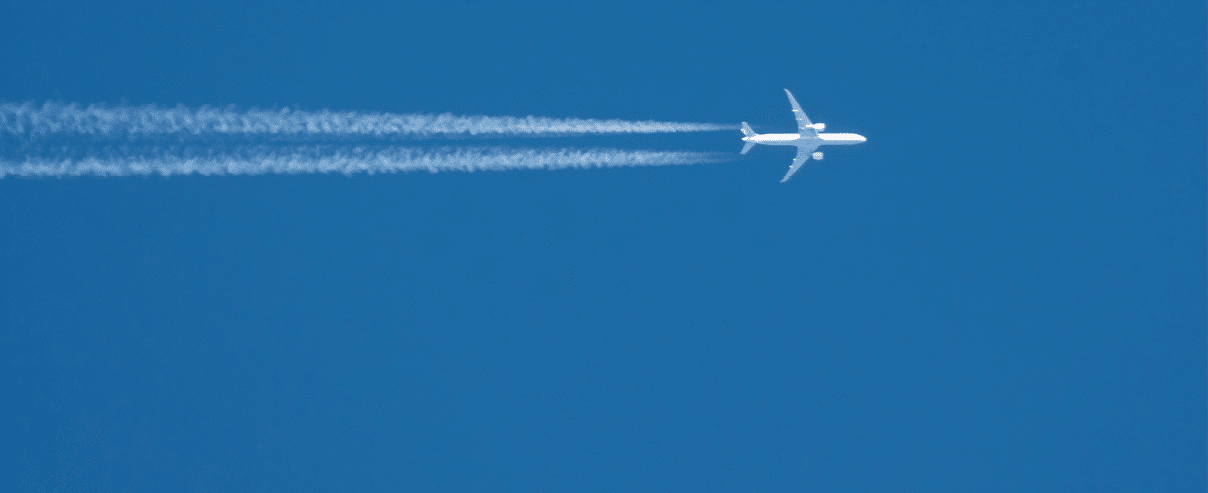 Trail from the plane with two enigine the blue sky